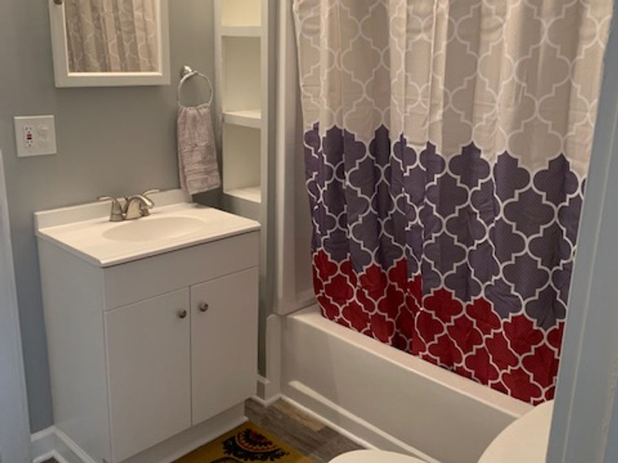 Remodeled bathroom with new vanity and tub surround by McNeill Construction in Fenton, Michigan